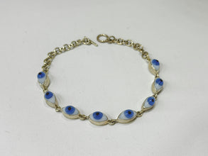 PULSERA OJO FORMA NATURAL BLANCO-AZUL - PLATA .925