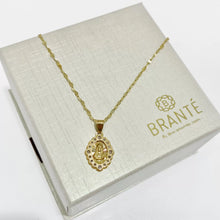 CADENA CON MEDALLA SAGRADO CORAZÓN OVAL CON CÍRCULOS ZIRCONIA -  ORO 10K