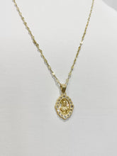 CADENA CON MEDALLA SAGRADO CORAZÓN OVAL CON CÍRCULOS ZIRCONIA -  ORO 10K