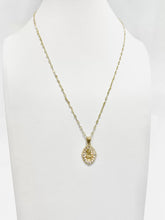 CADENA CON MEDALLA SAGRADO CORAZÓN OVAL CON CÍRCULOS ZIRCONIA -  ORO 10K