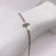 PULSERA TIPO TENNIS CON CRUZ TRANSVERSAL - ORO 10K